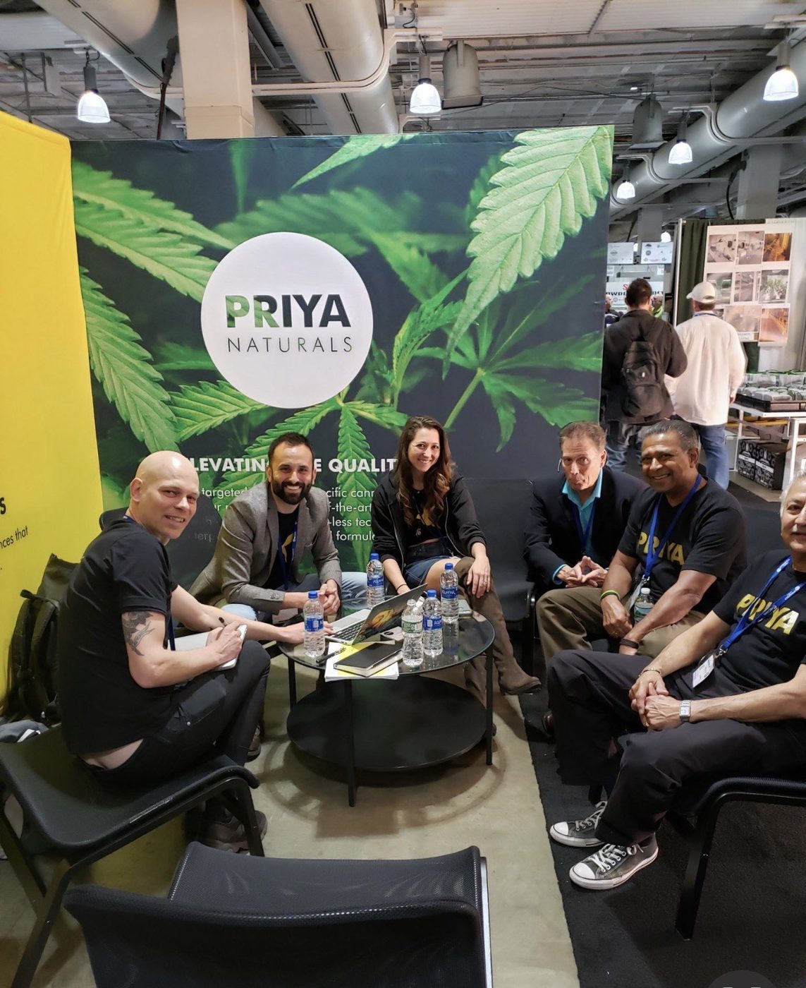 The Priya Naturals team meeting at their trade-show booth